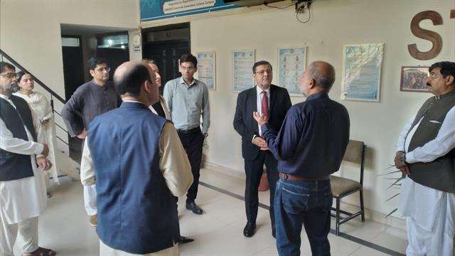 The Director being briefed inside the Department of Statistics