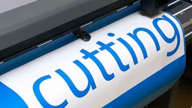 Vinyl lettering being cut on the plotter