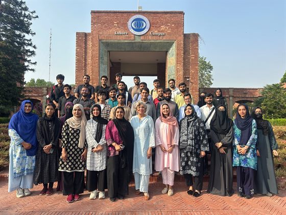 Participants of the Aspire Leaders Program seminar gathered at the Lahore Campus gate