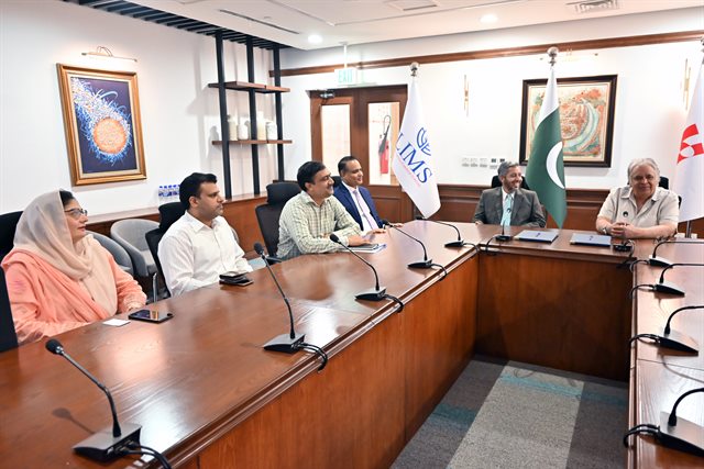 The CUI Lahore delegation seated in the boardroom before the ceremony