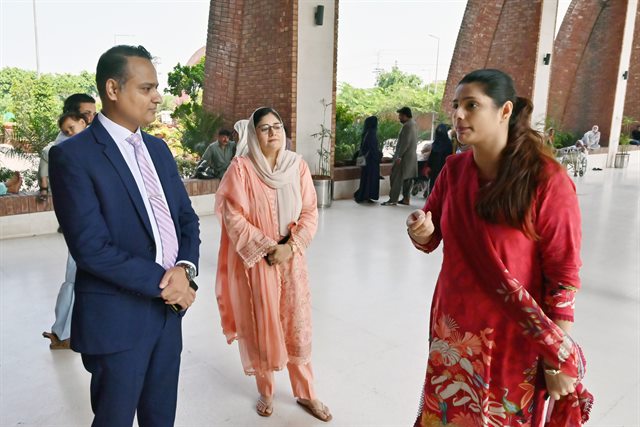 The delegation being received at the hospital entrance at the start of the visit