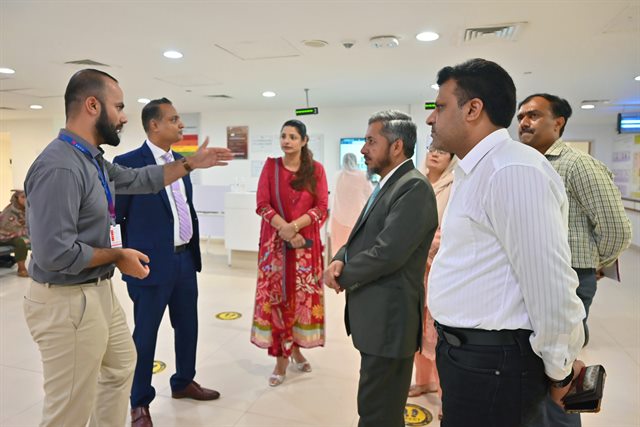 The delegation in the outpatient reception area during the tour of the hospital