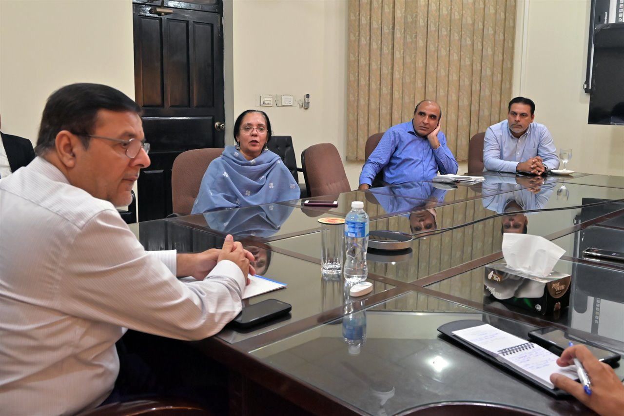 A meeting in the campus boardroom