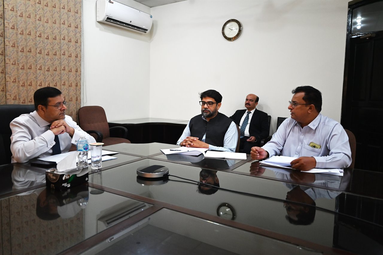 Section heads in discussion around the boardroom table