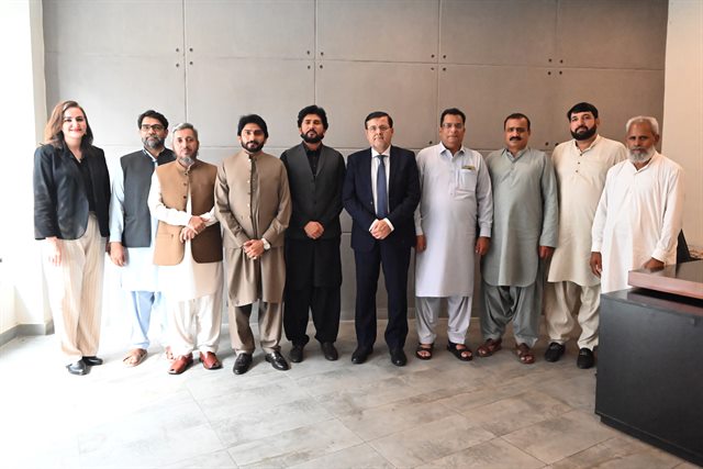 Staff members with the Director after one of the day's meetings