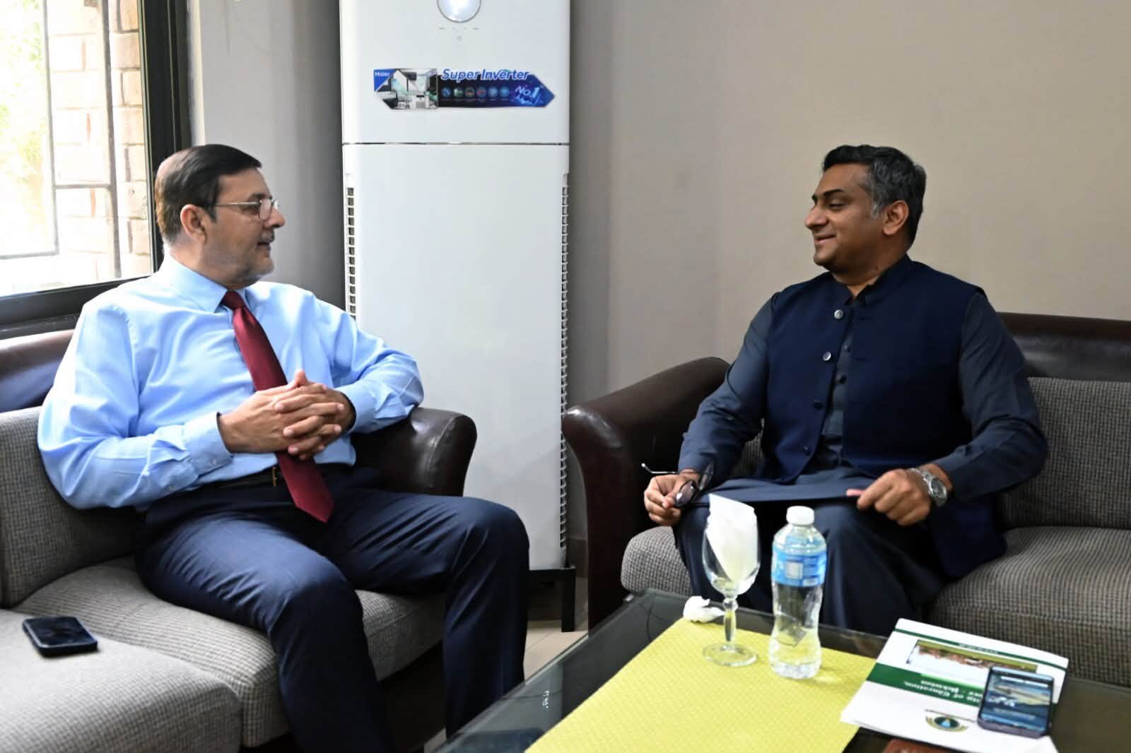 The Campus Director in conversation with a visitor at the Director Secretariat
