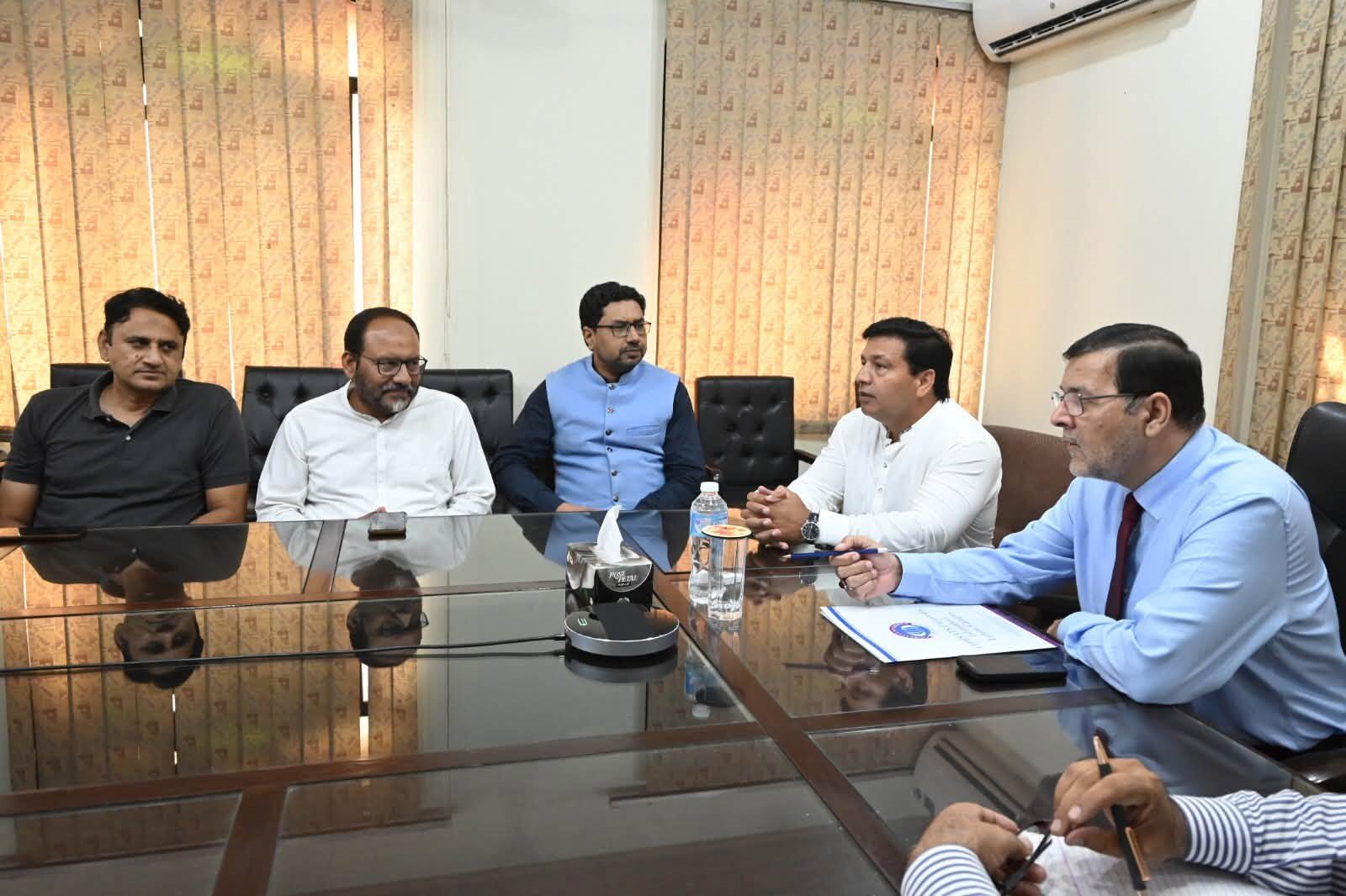 A departmental meeting with the Campus Director in the boardroom