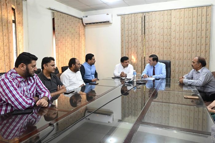 A working meeting around the boardroom table