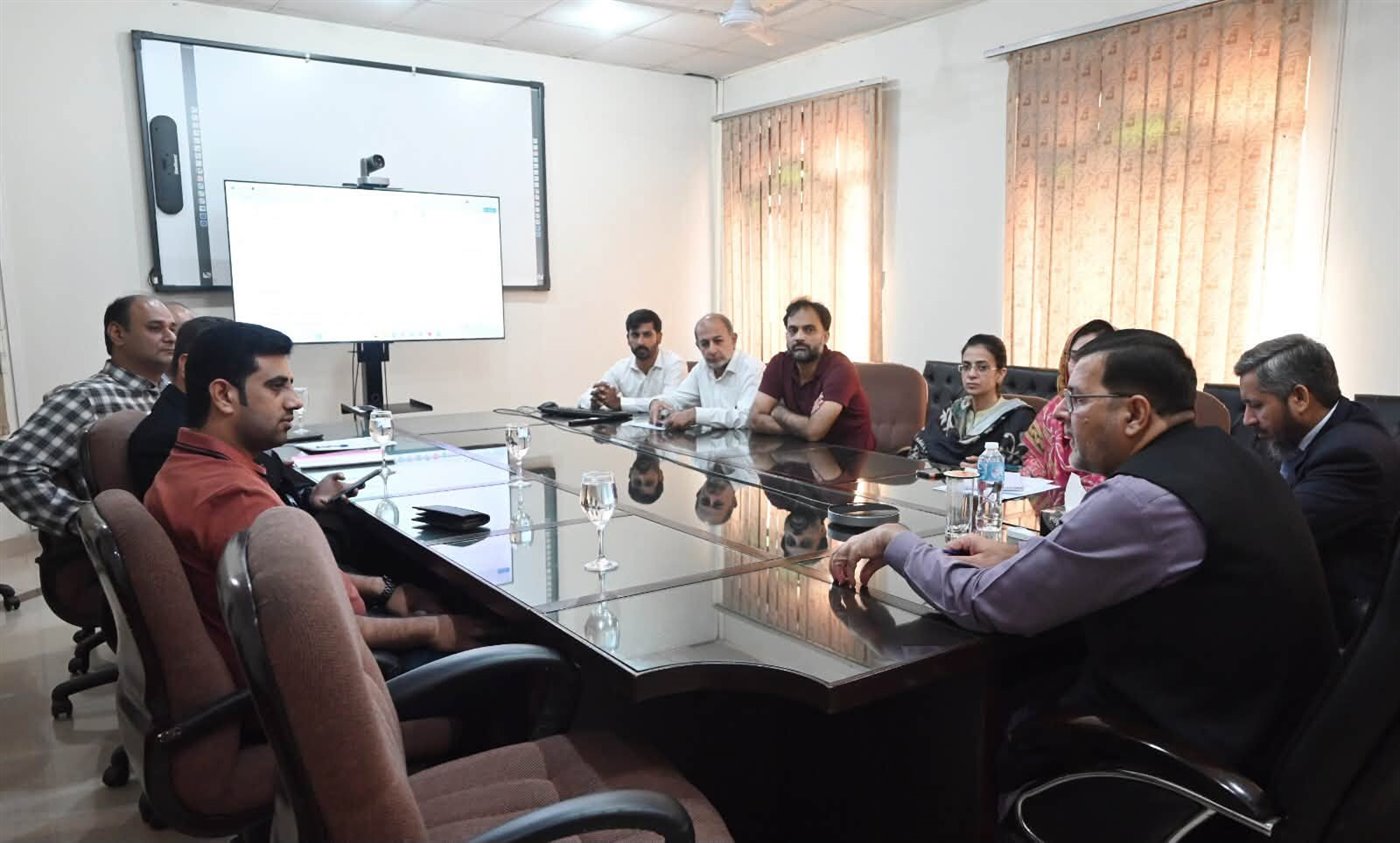 The Campus Director meeting a visiting delegation around the boardroom table