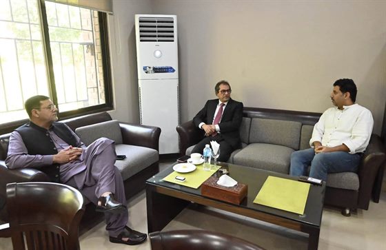 The Campus Director in conversation with a visitor