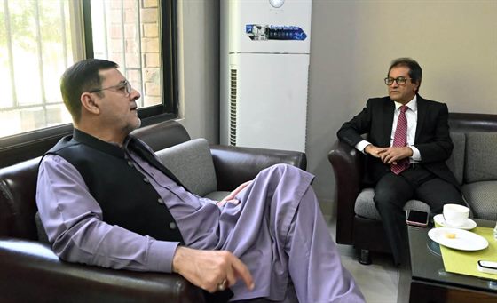 A visitor seated with the Campus Director