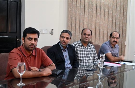 Colleagues seated at the Director Secretariat
