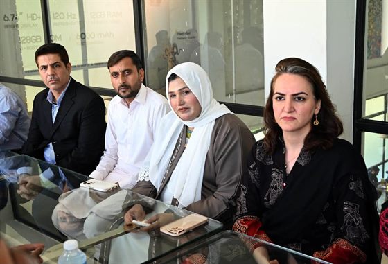 Colleagues seated around the meeting table