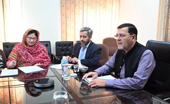 The Campus Director chairing a meeting in the boardroom