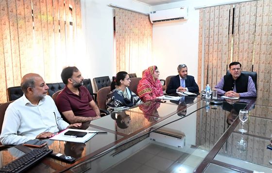 Heads of Department seated at the meeting table