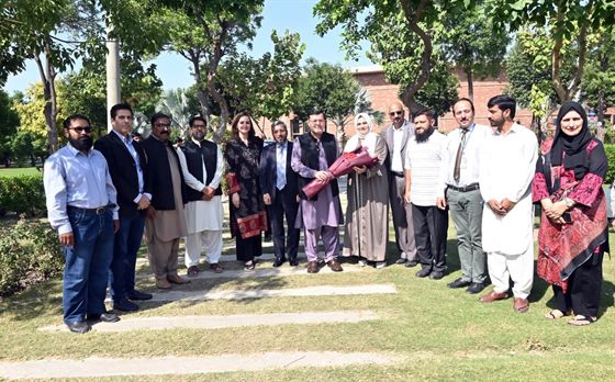 Faculty members and guests gathered on the campus lawn