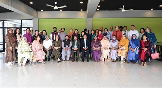 A group photograph of the gathering with the Campus Director