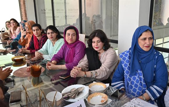 Faculty members seated at the lunch