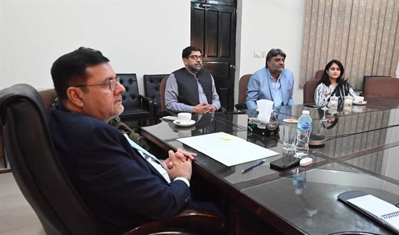 The Campus Director chairing a meeting in the boardroom