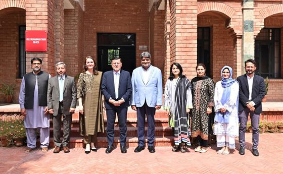 The Campus Director with faculty members outside the Gul Muhammad Shah Block