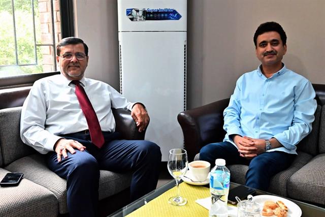 The Director meeting a visitor in his office