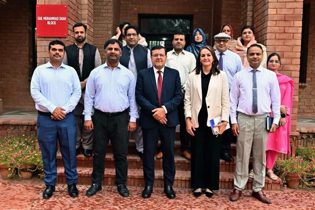 The Director with a department's faculty members outside the Gul Muhammad Shah Block