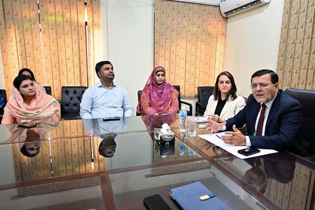 The Director chairing an introductory meeting with faculty members