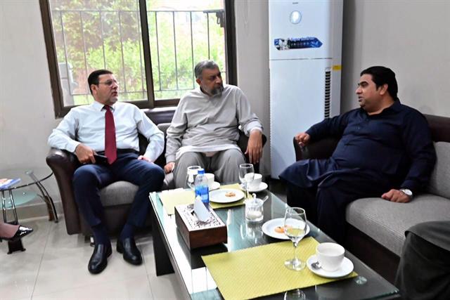 The Director receiving visitors in his office