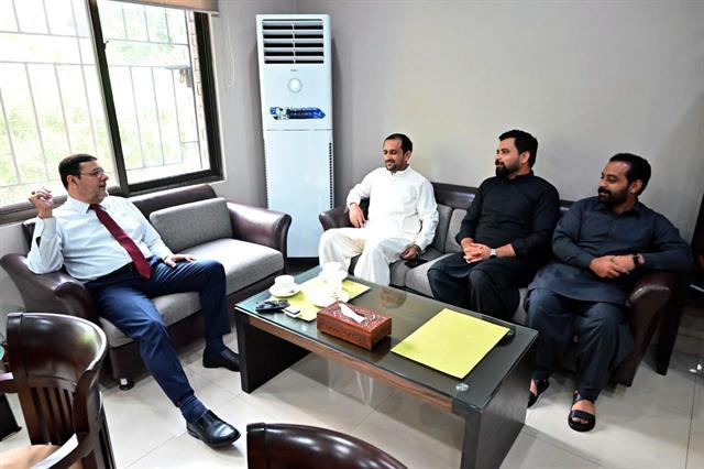 A meeting with a visiting delegation in the Director's office