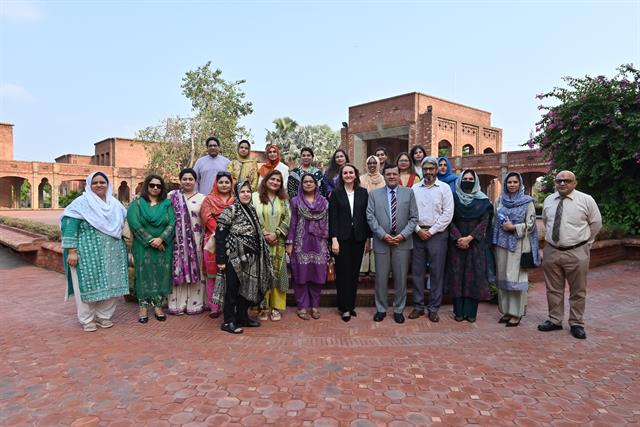 Prof. Dr. Qaisar Abbas with faculty members outside the campus building