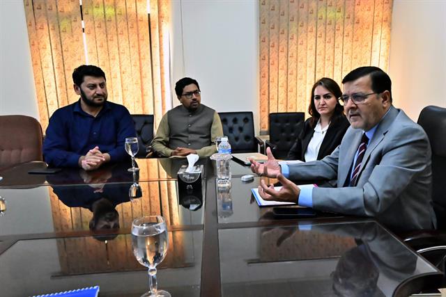 The Director addressing faculty members