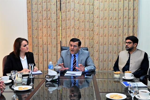 The Director speaking during a meeting