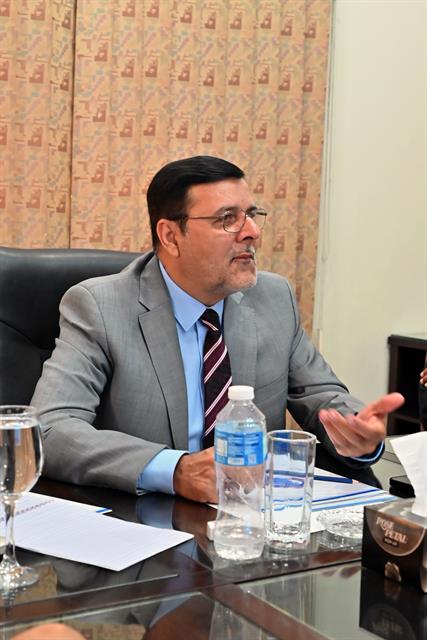 Prof. Dr. Qaisar Abbas speaking during a meeting