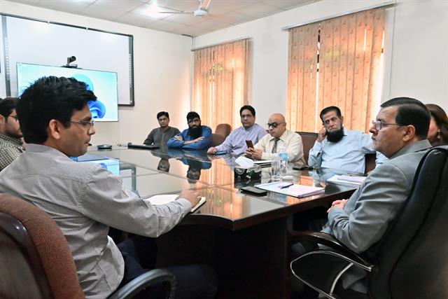 A department meeting in the boardroom