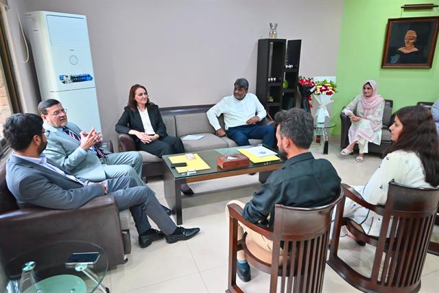 A discussion with faculty members in a department office