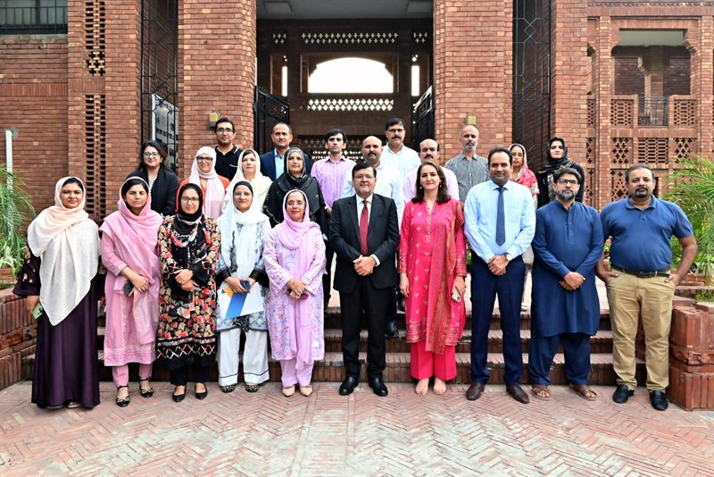 Group photograph of the Director with IRCBM faculty members on the building steps