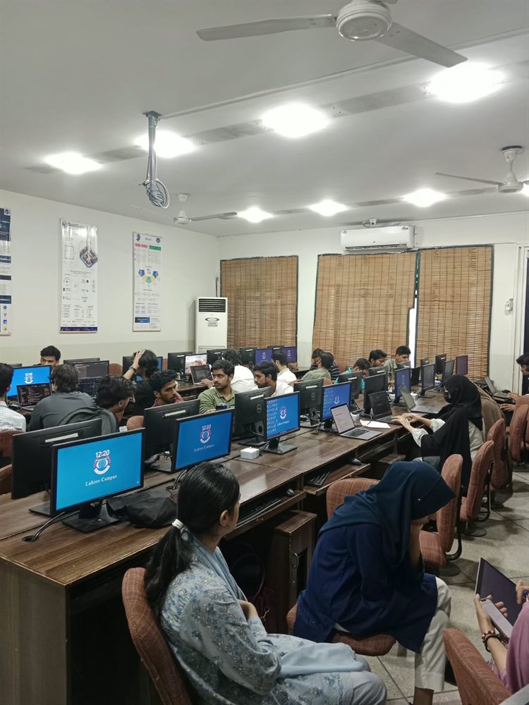 Participants coding in the computer lab during Infinity Hack