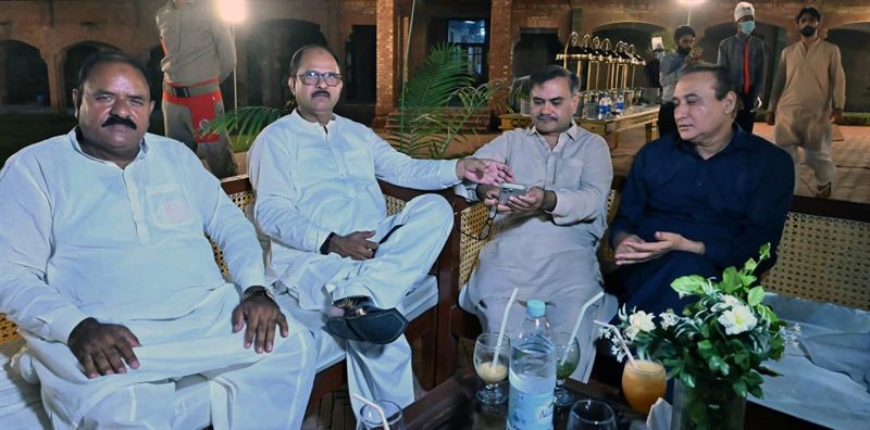 Guests in conversation during the evening