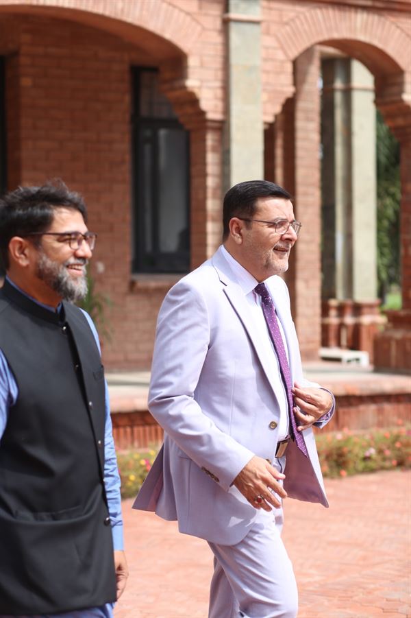 The Director leaving with a colleague after the ceremony
