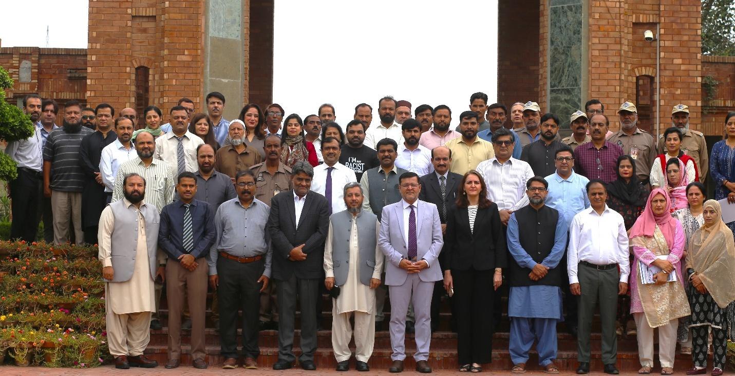 Prof. Dr. Qaisar Abbas with the promoted faculty members, officers and staff at COMSATS University Islamabad, Lahore Campus