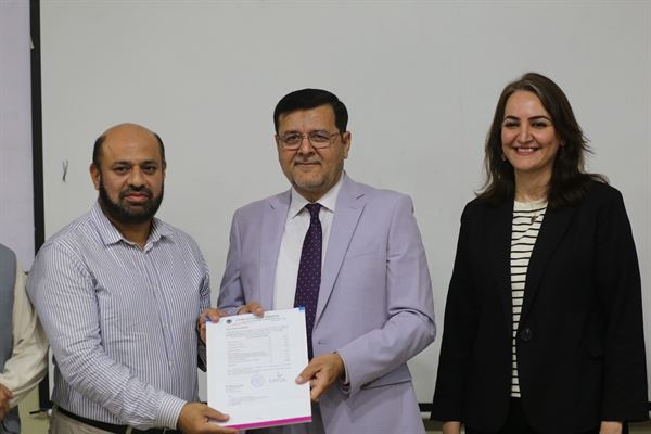A promotion letter being handed to a member of staff