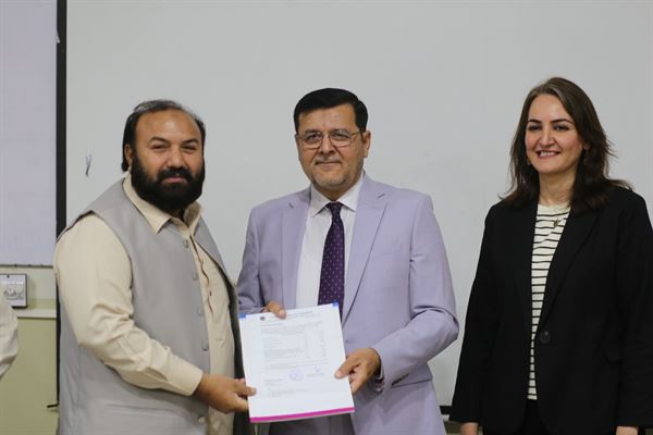 A staff member receiving his long-pending promotion letter