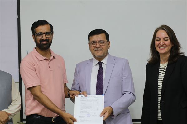 A promoted colleague holding his letter