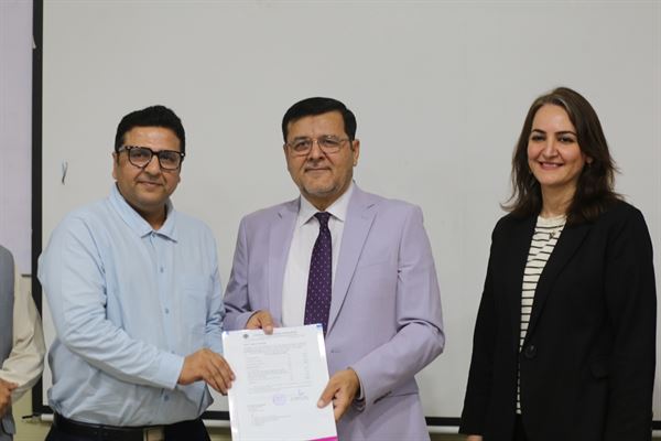 A member of staff receiving the promotion letter