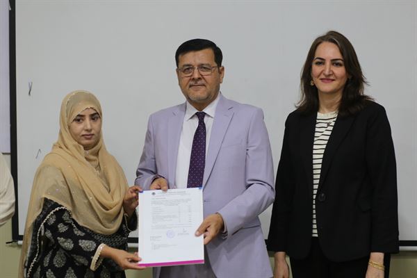 A woman colleague receiving her promotion letter