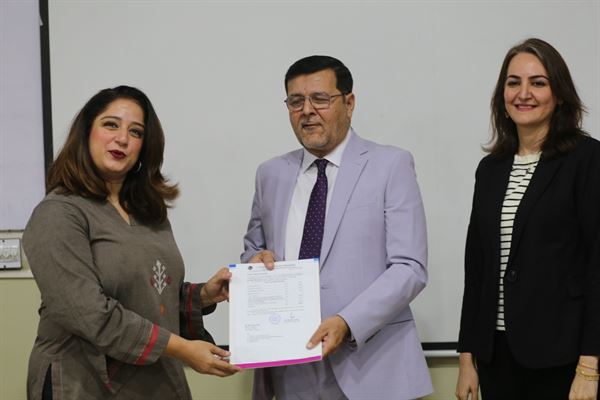 A colleague receiving her promotion letter