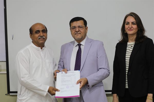 A staff member receiving his promotion letter