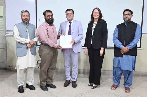 A colleague receiving his promotion letter from the Director