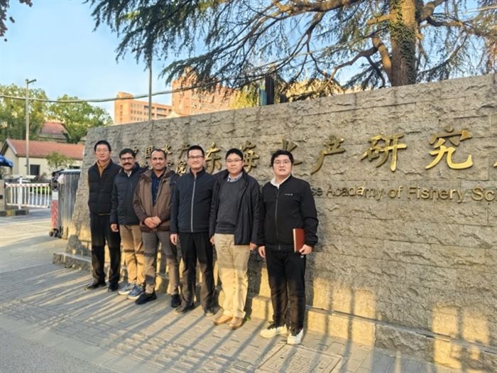 Visiting delegation at the entrance to the research institute