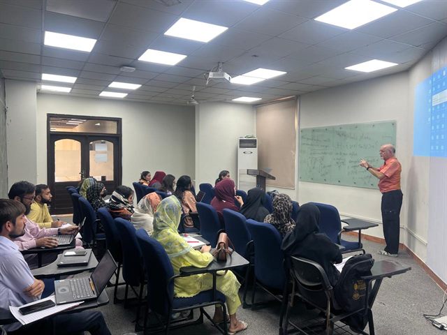 Prof. Pierre Arnoux lecturing in the IMPM Room